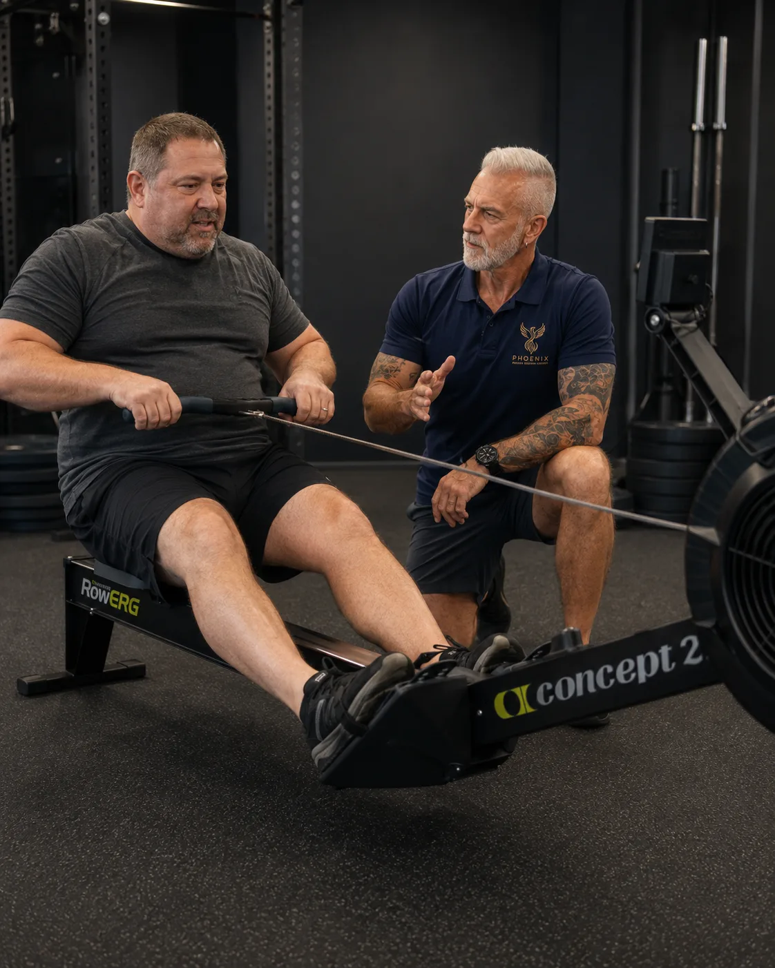 Matthias coaching a client on the rowing ergometer
