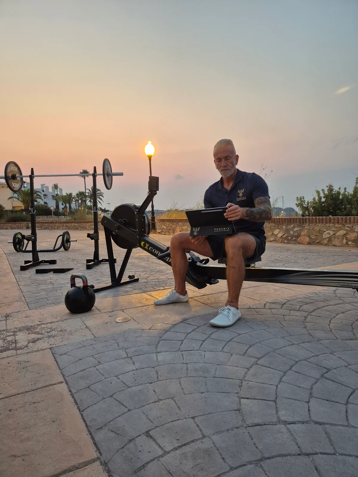 Matthias planning the training session at the outdoor setup at sunrise