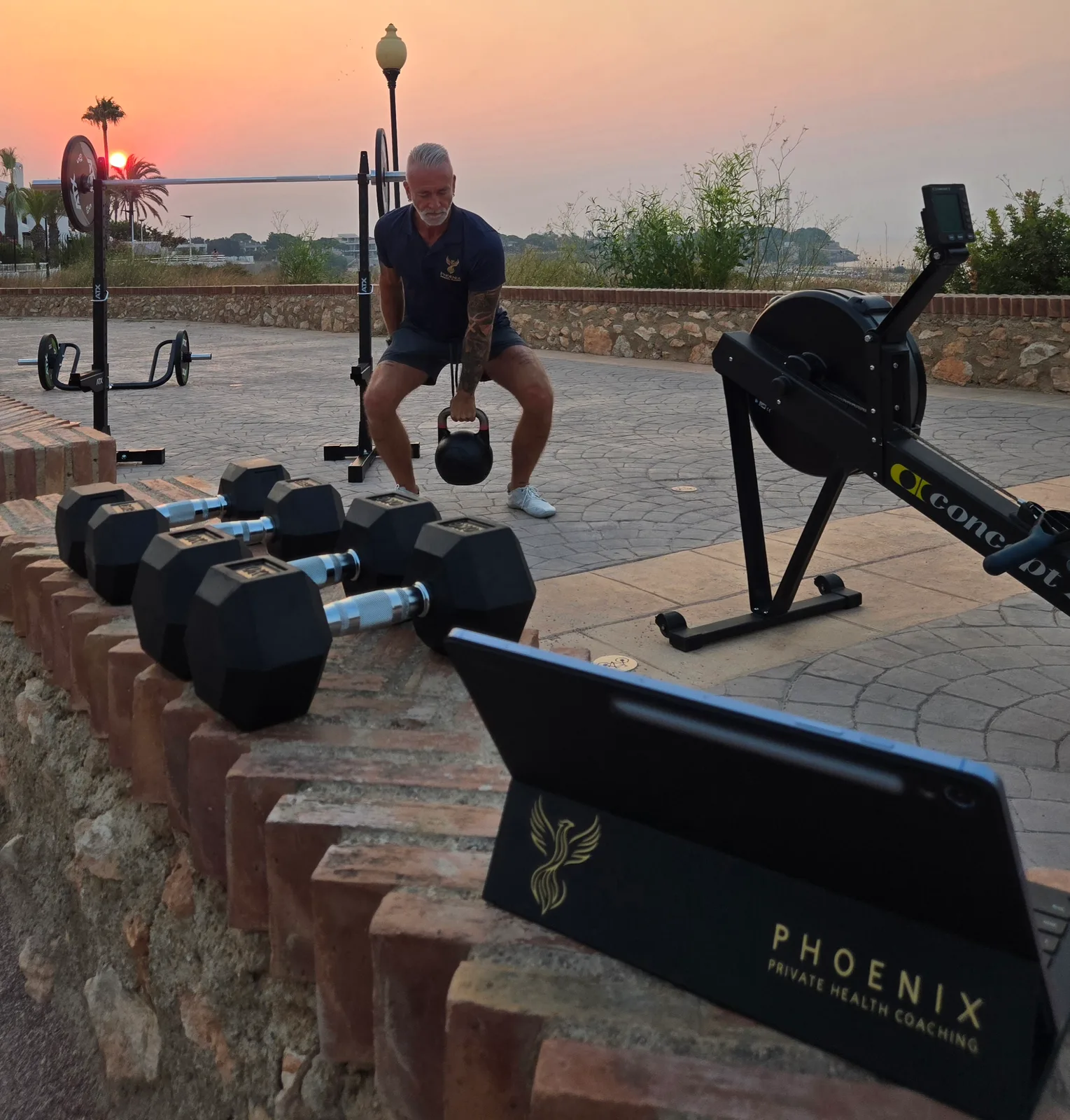 Matthias training with a kettlebell at sunrise on the Costa Blanca